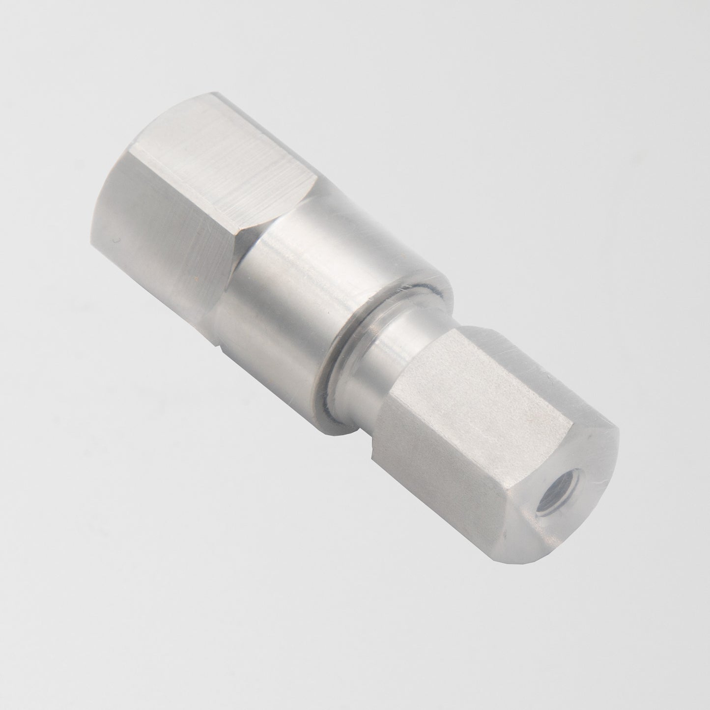 A stainless steel threaded fitting displayed against a clean white background, showcasing its sleek design and durability.