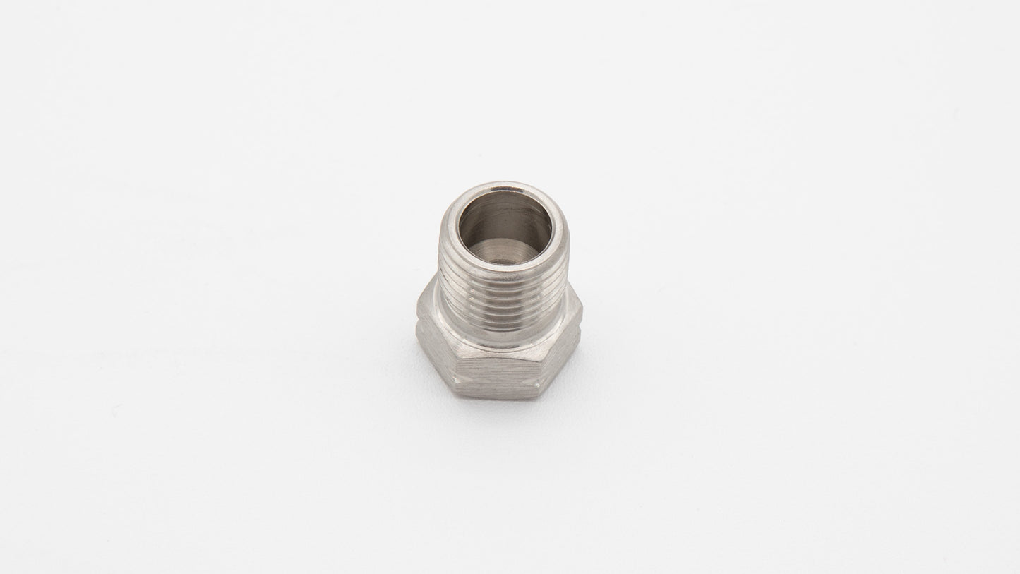 A close-up of a stainless steel nut resting on a clean white surface, showcasing its metallic texture and design.