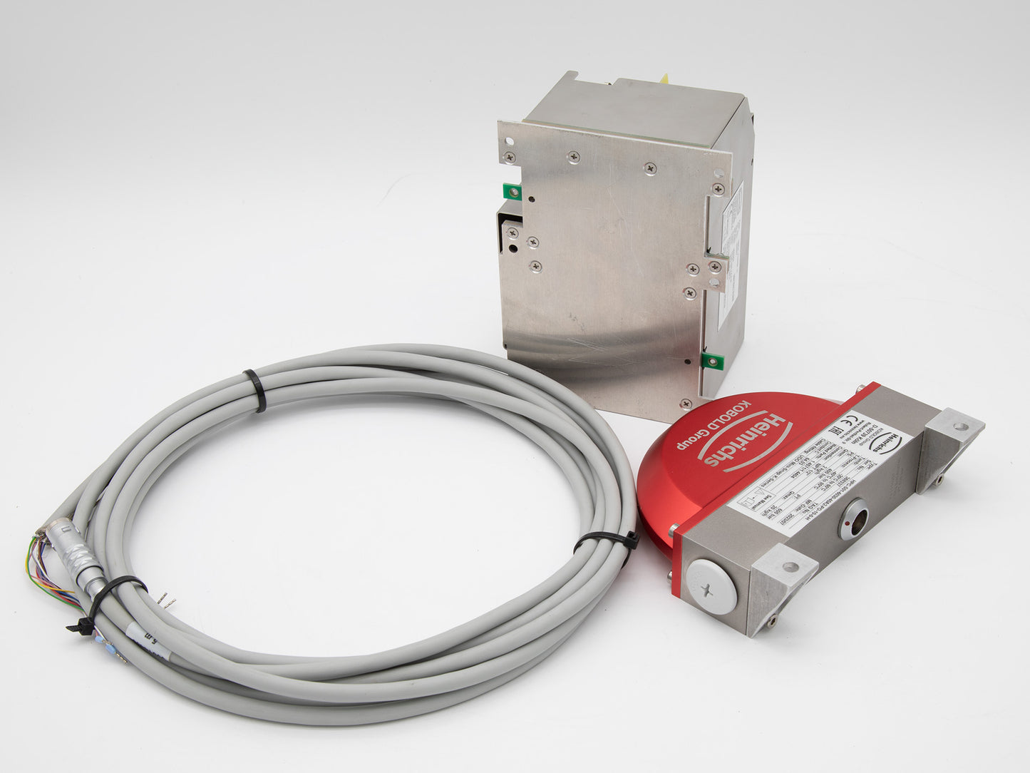 A red and white electrical device with a cable, showcasing a modern design suitable for various electronic applications