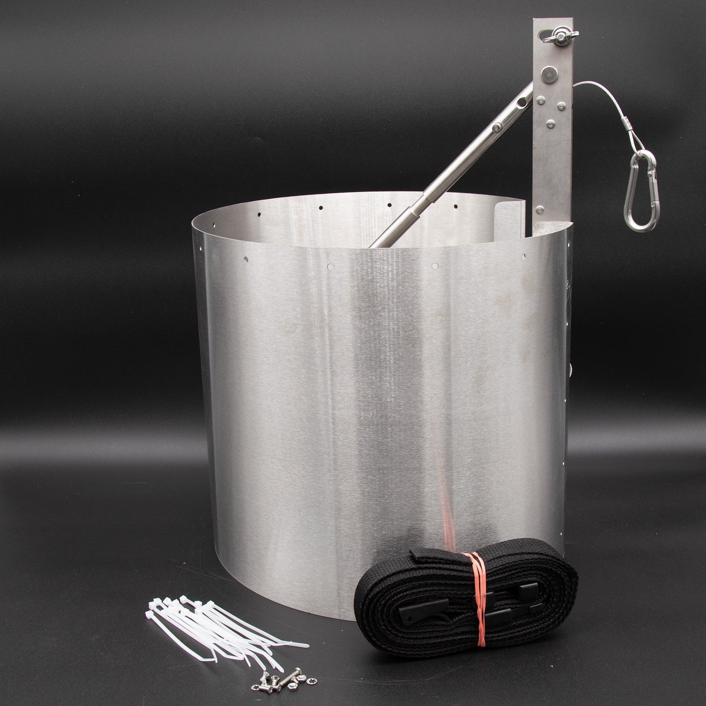 An image depicting a metal cylinder, a strap, and a metal rod, illustrating essential equipment for various tasks.