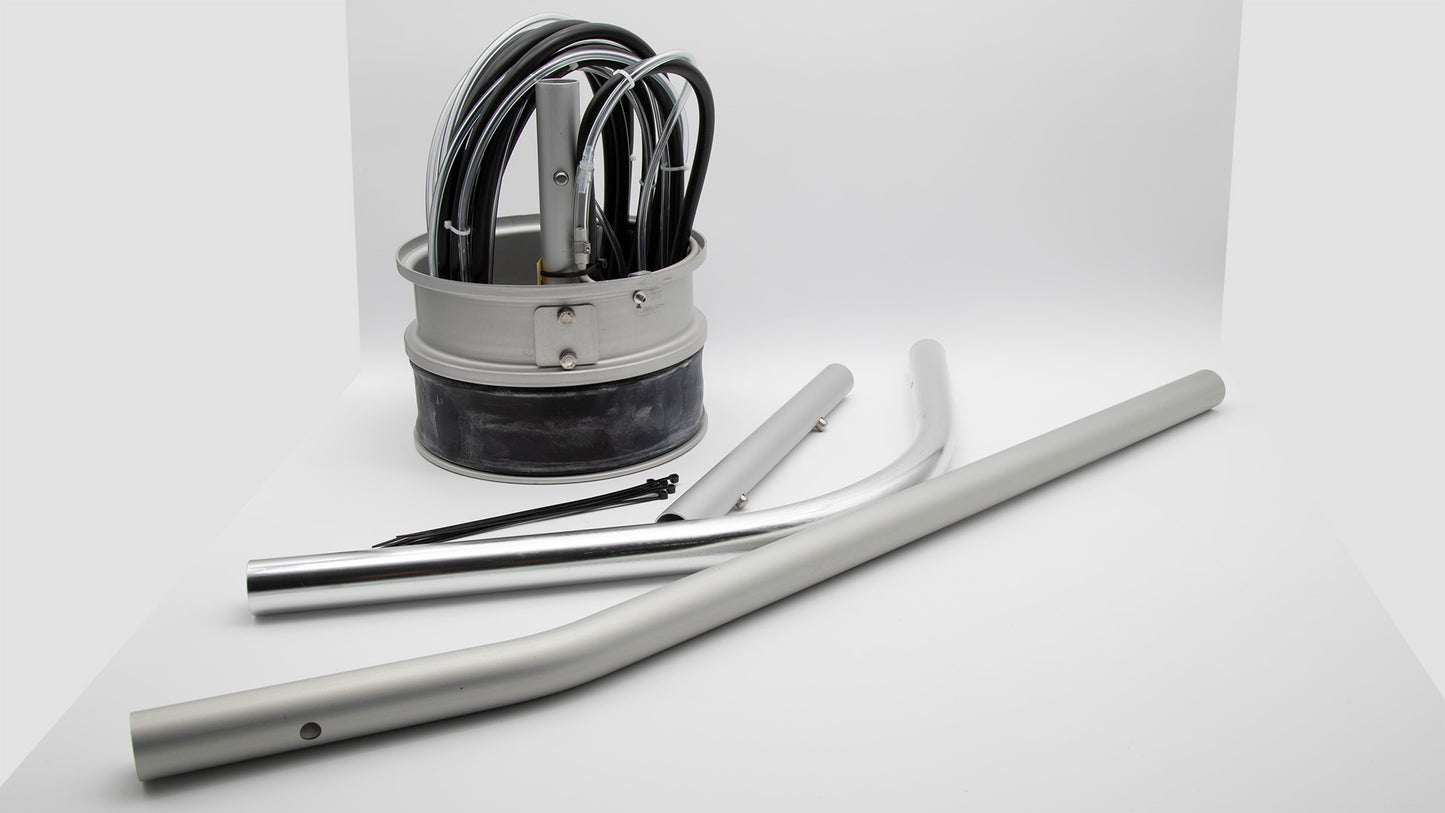 An assortment of items, prominently showcasing a cylindrical insert and hose, indicative of flow measurement products.