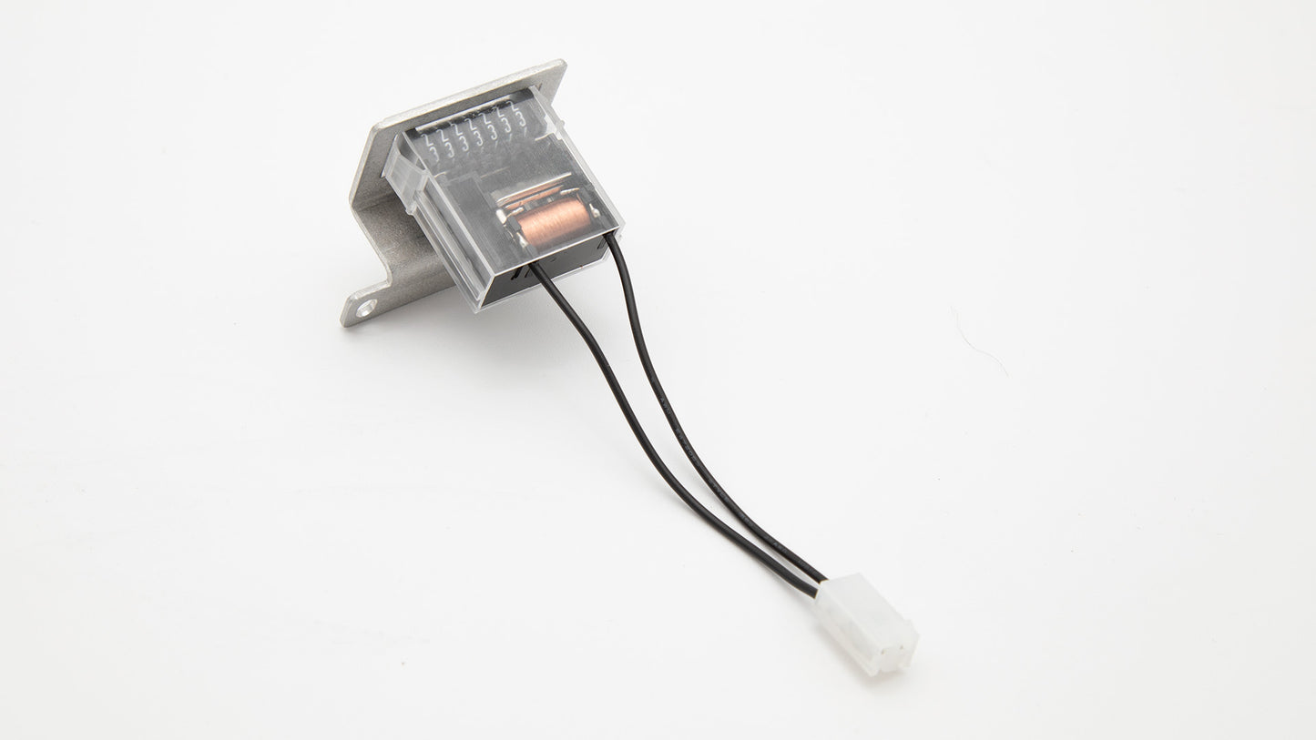 A small electronic device connected by a wire, showcasing its compact design and functionality.