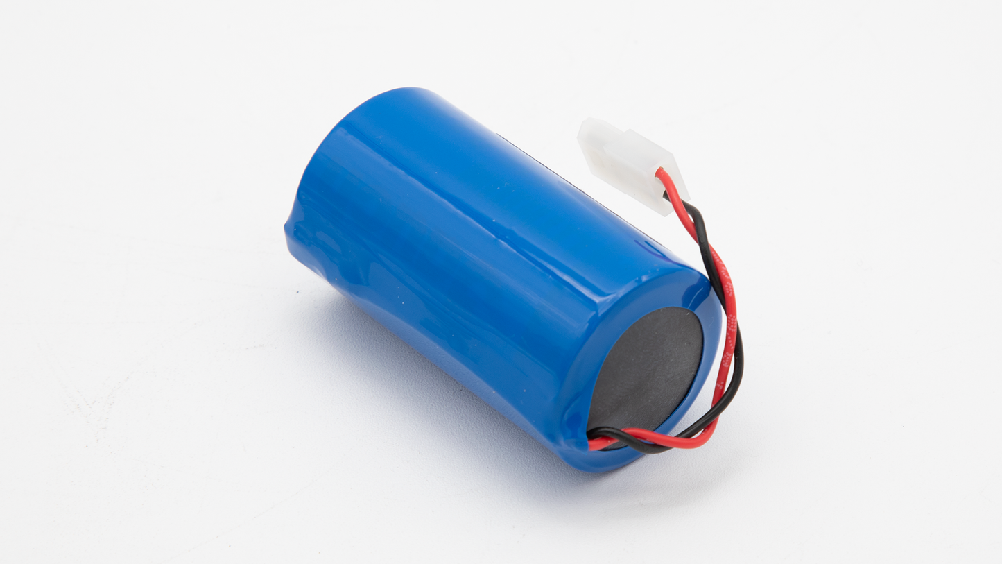 A close-up of a battery labeled "lithium," showcasing its cylindrical shape and metallic finish.