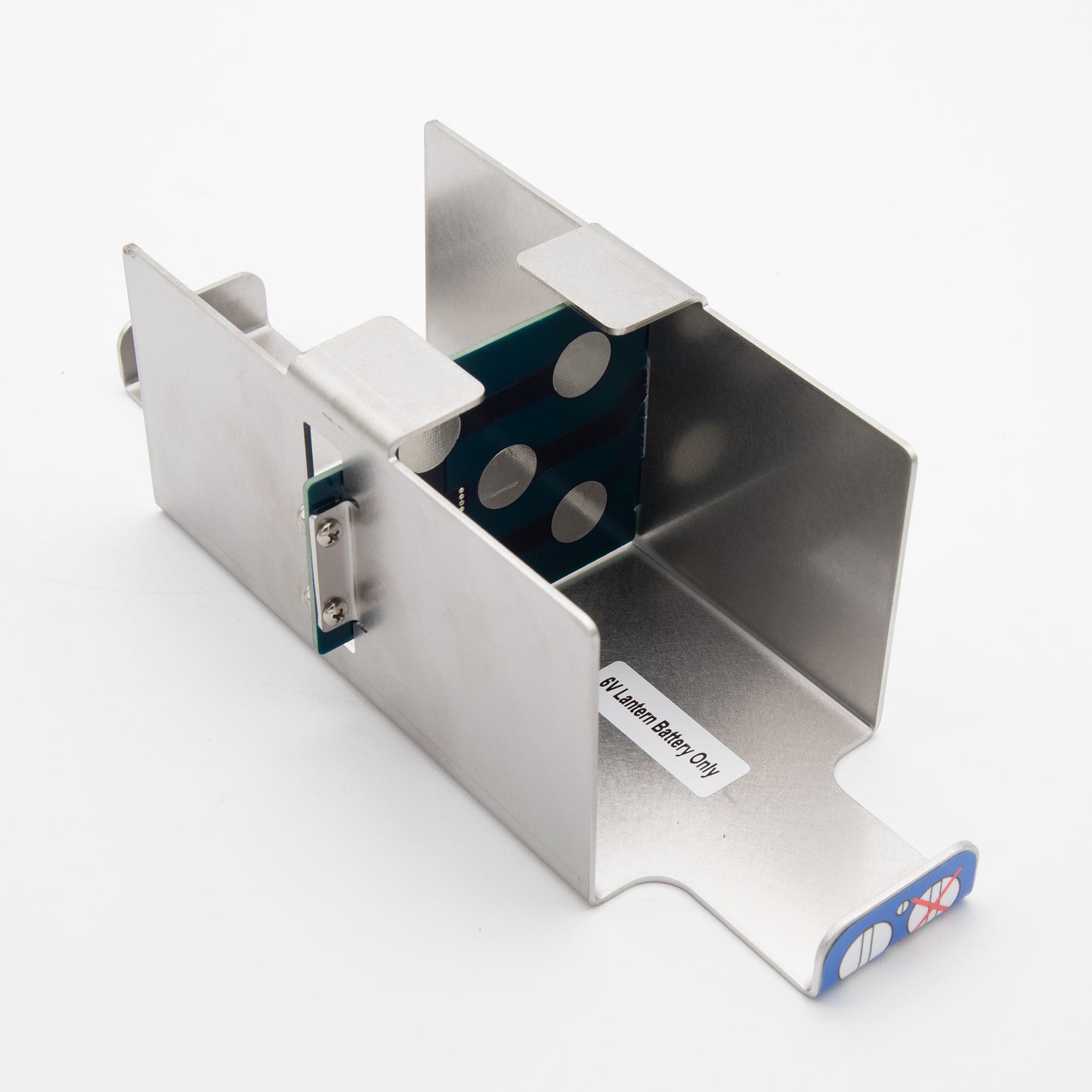 A metal box featuring a blue sticker affixed to its surface, showcasing a simple yet distinct design.