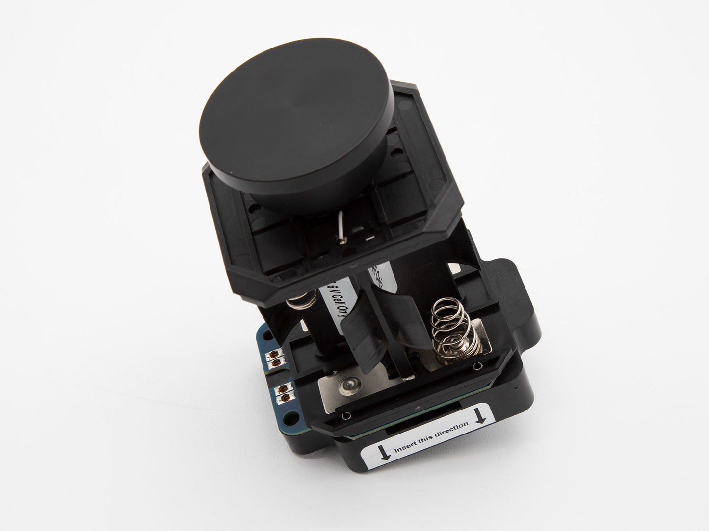 A black battery holder featuring springs and plastic components, showcasing its sleek design and functionality.