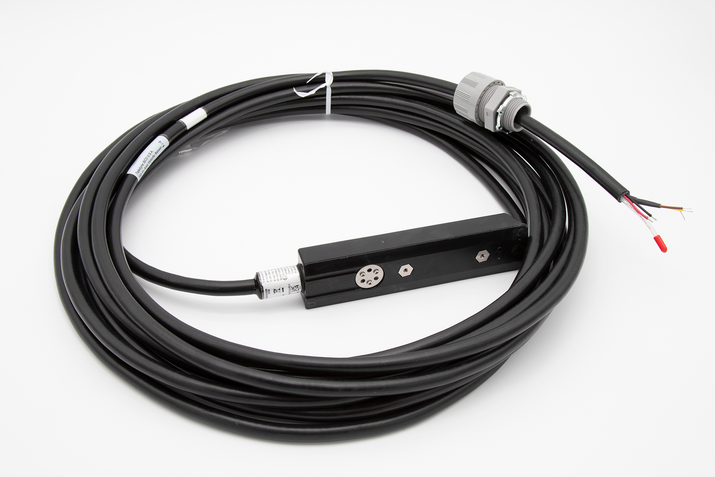 A black cable with a sensor, plug and two wires, representing a basic electrical component for connections.