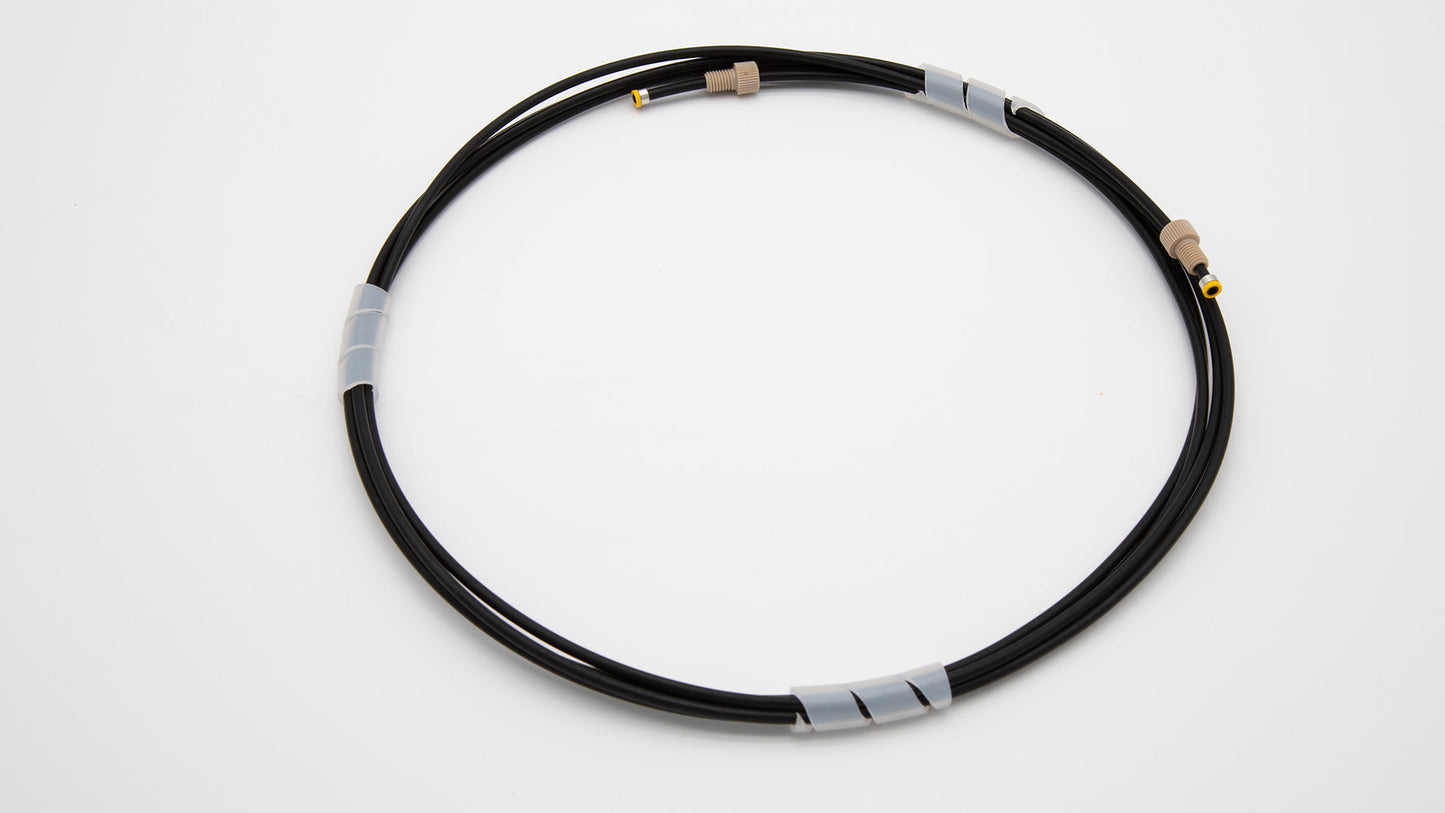 Black tubing with connectors on each end, laid out on a clean white surface, showcasing a functional design.