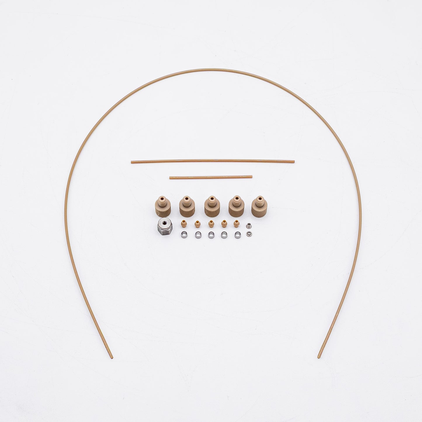 A set of tan-colored nuts and matching metal fittings arranged on a plain white background, with three varied sizes of tubing.