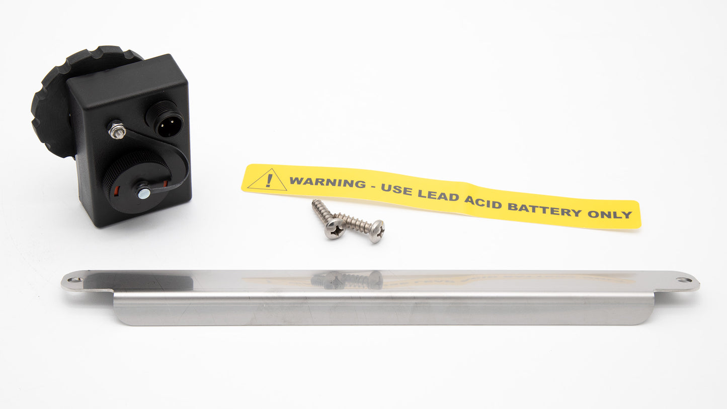 A metal plate and connector and screws featuring a yellow warning label, indicating caution or alertness.