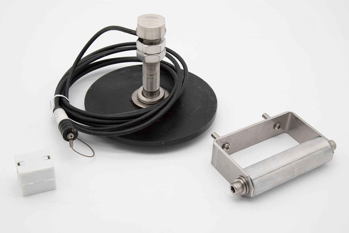 A metal device featuring a cable and plug, designed for electrical connections and functionality.