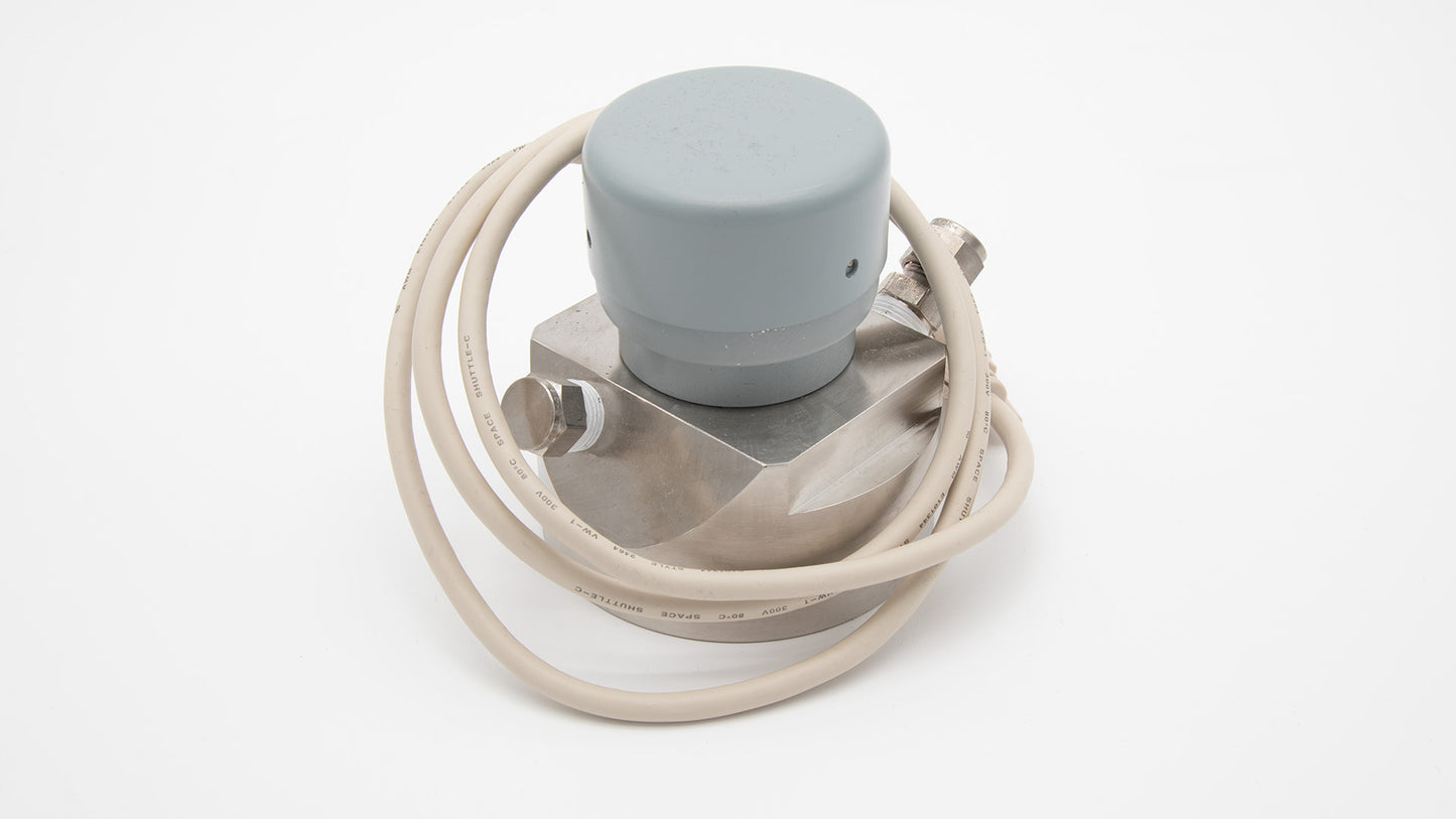 A metal device connected to a white cord, showcasing a sleek and modern design suitable for various applications.