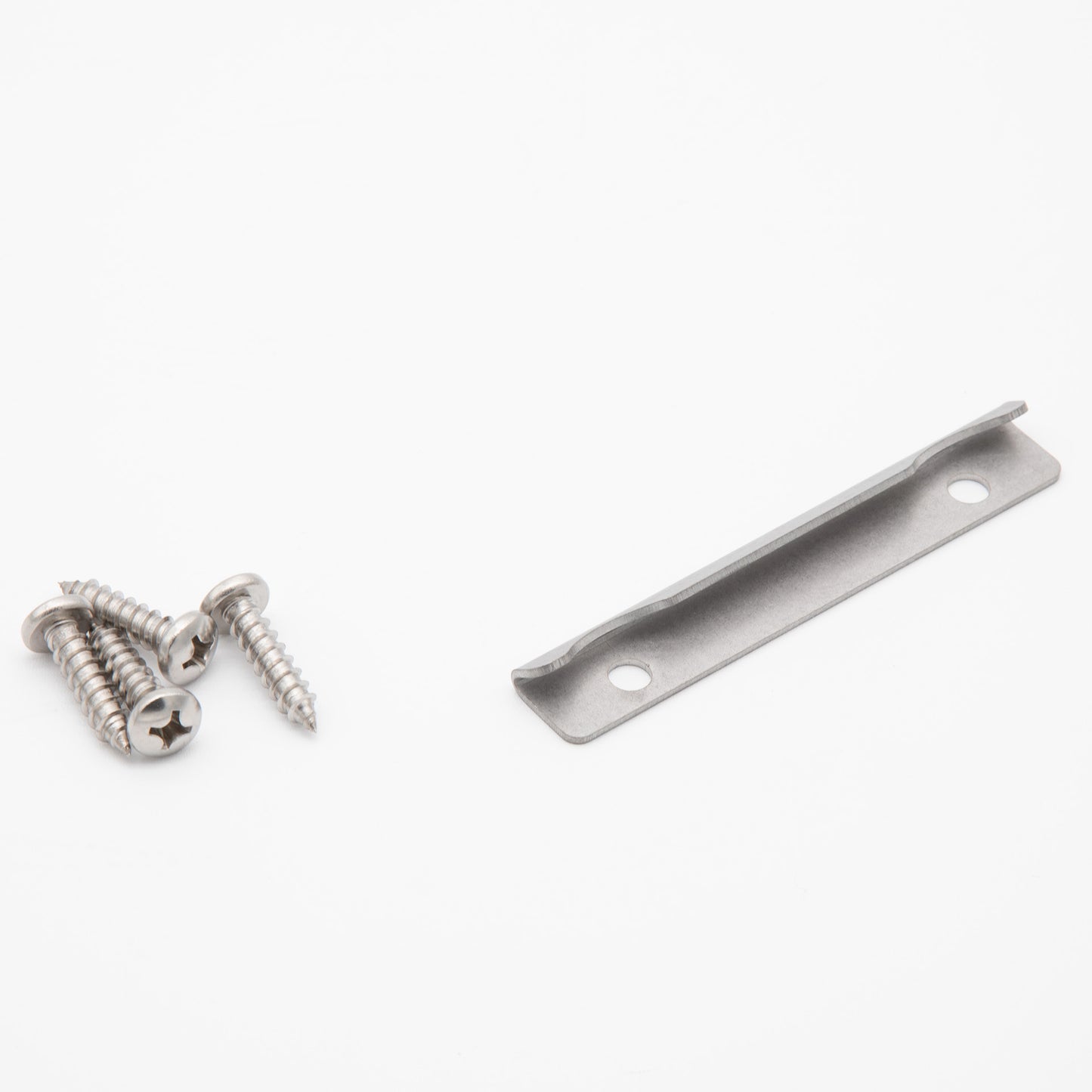 Two screws lying beside a rectangular metal plate, showcasing their metallic texture and design.