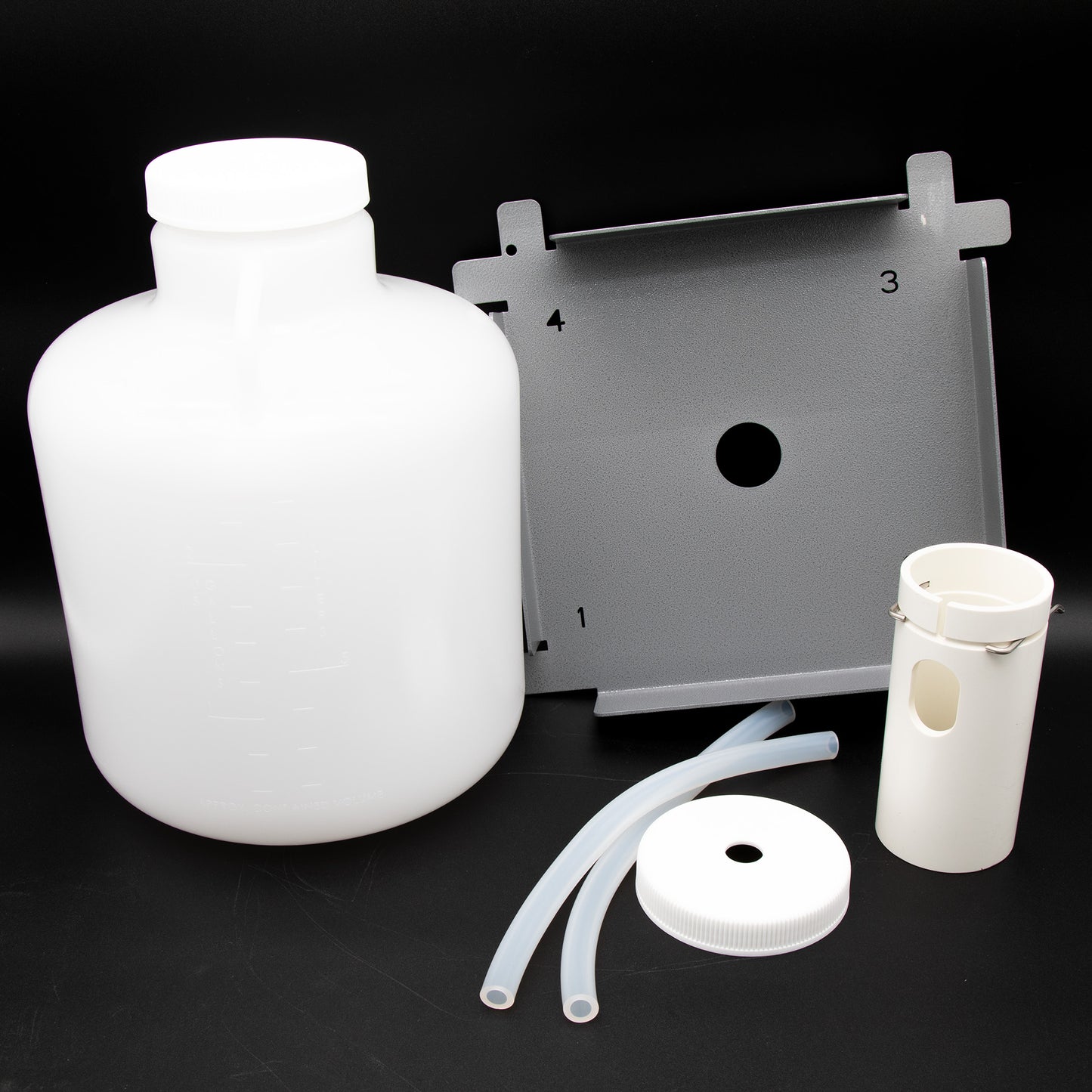 A plastic container arranged neatly with a locating platform and other assorted items, showcasing their functional design.