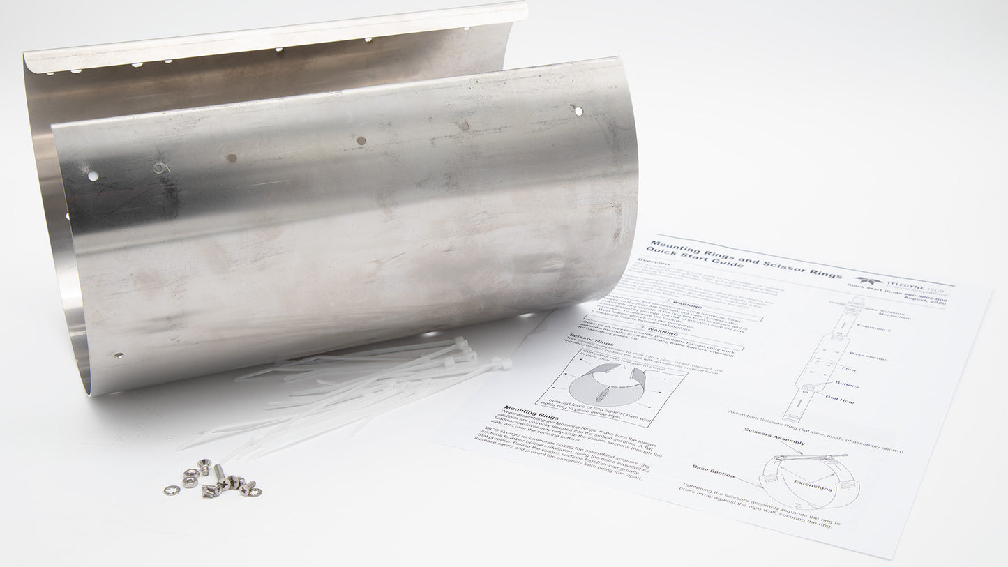 A metal cylinder featuring various screws and tie straps plus an instruction sheet on its surface.