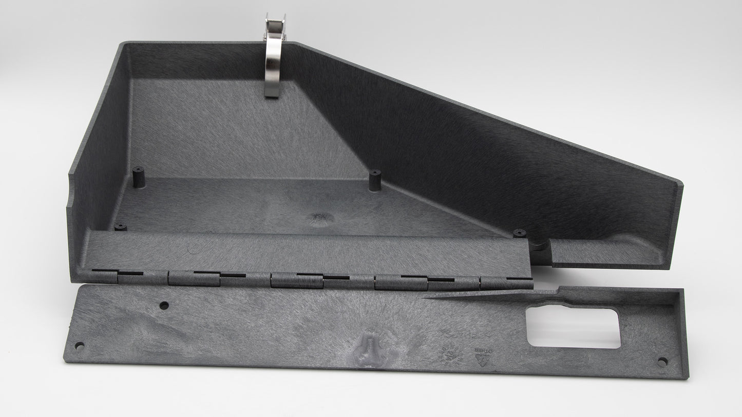 A black plastic box featuring two hinges.