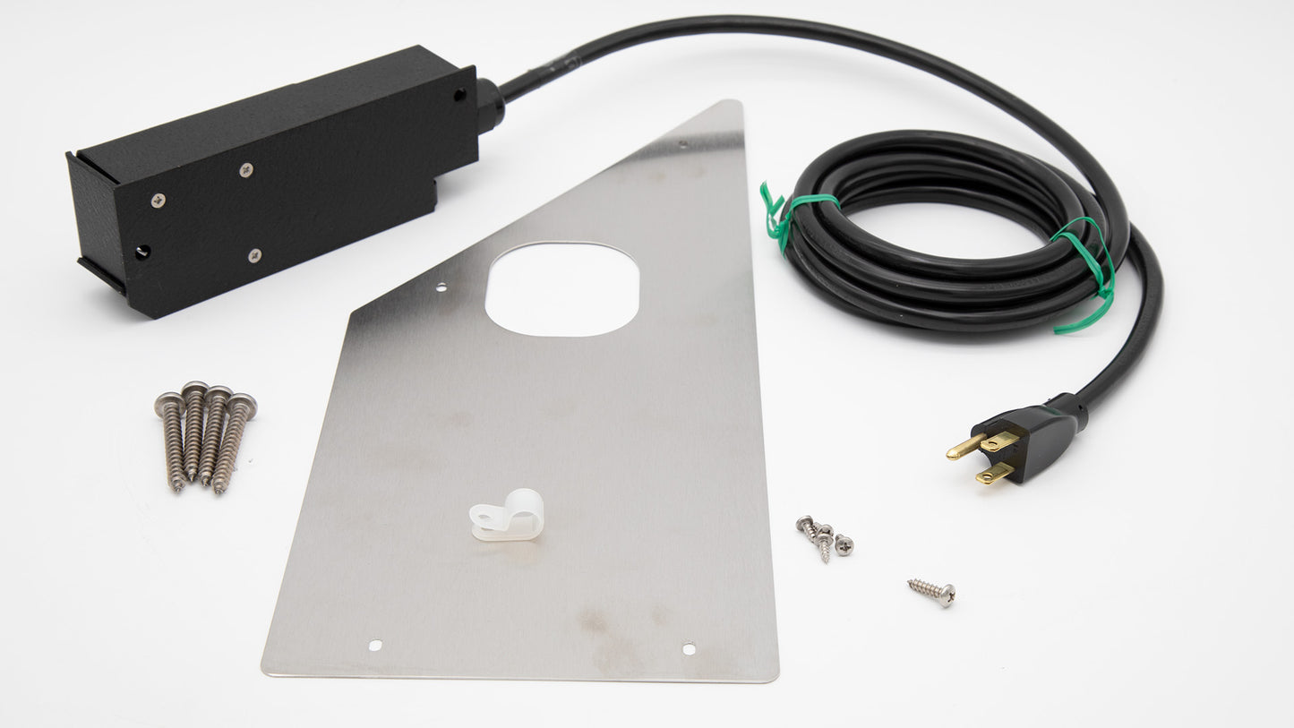 A black colored heater containing with power cord and steel plate, showcasing a compact and organized setup.