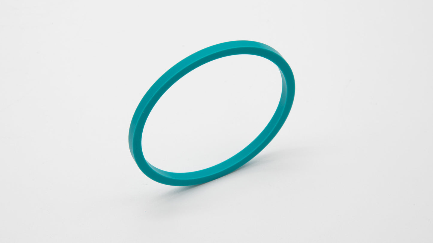 A turquoise seal displayed on a clean white surface, showcasing its vibrant color and elegant design.