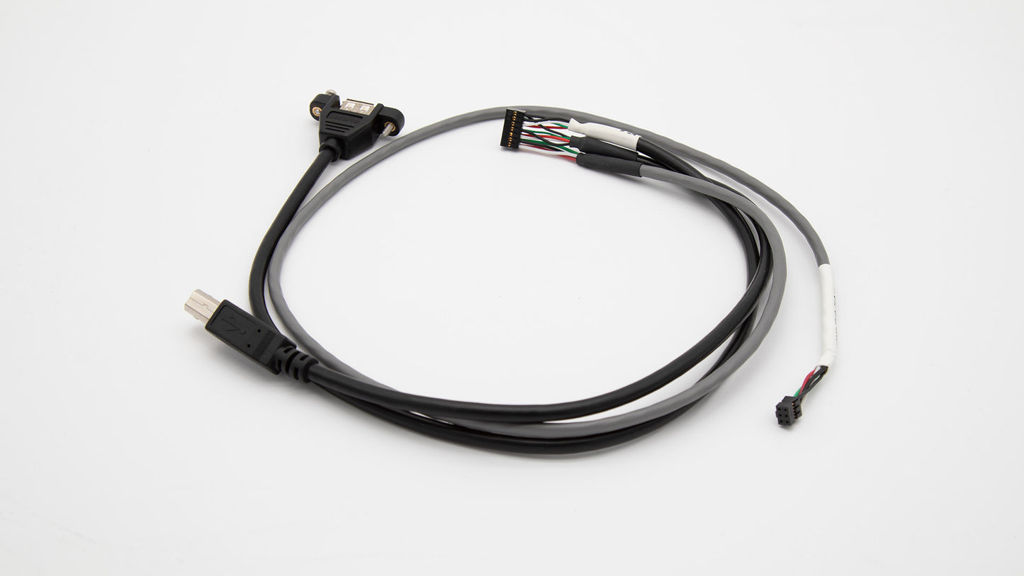 A close-up of a cable with a black and white cord attached, highlighting its contrasting colors and practical use.