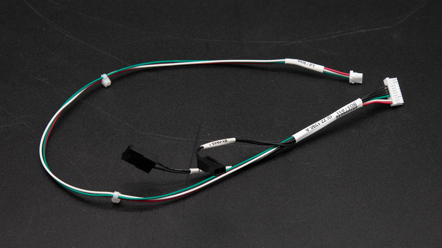 A close-up of a cable featuring multiple wires and a connector, showcasing its intricate design and functionality.