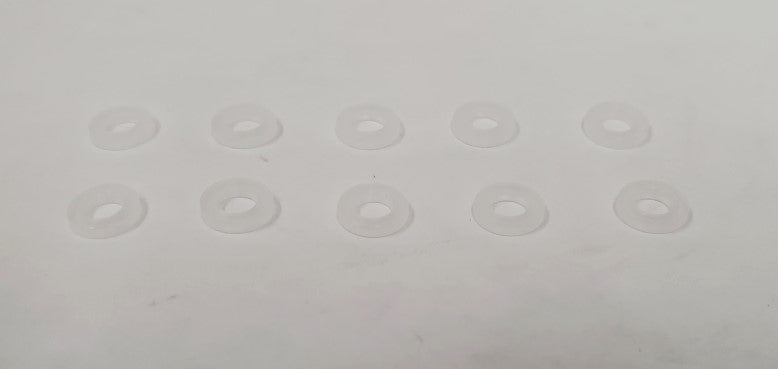 A collection of ten white plastic ovals arranged neatly on a white surface, creating a minimalist aesthetic.