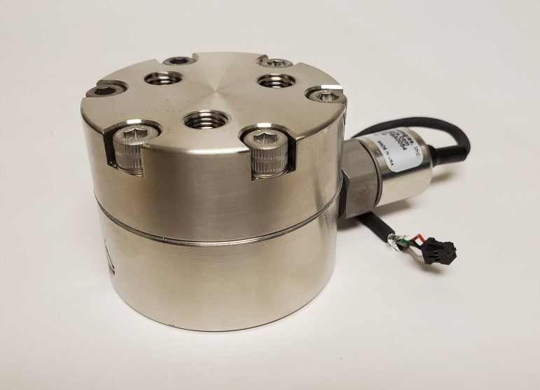 Metallic cylindrical device with threaded ports on a white background