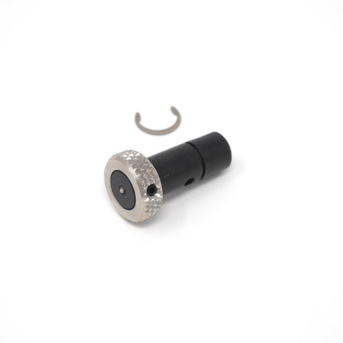 A detailed view of a black and silver threaded metal object highlighting its unique threading and metallic finish.