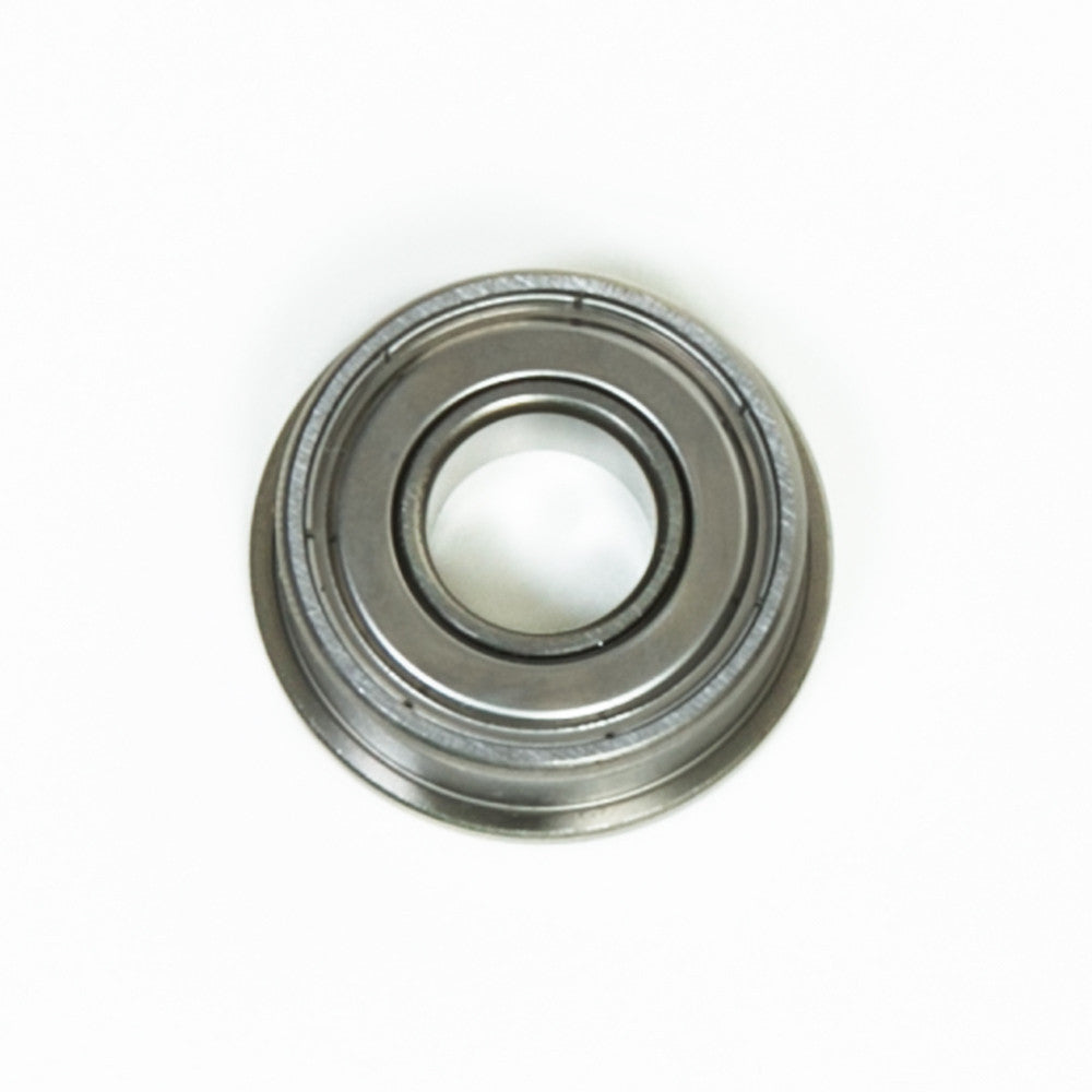 A close-up view of a bearing placed on a white background, showcasing its cylindrical shape and metallic finish.