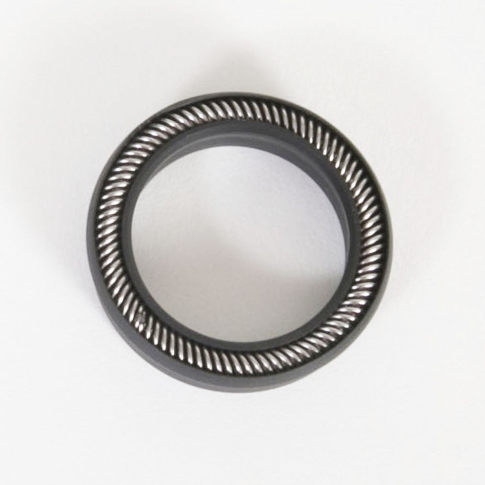 Close-up image of a round black seal on a white surface, emphasizing its sleek design.