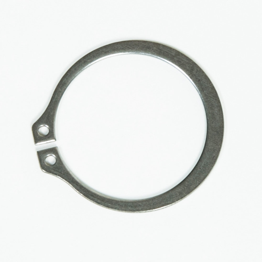 A simple metal ring displaying a hole in the middle, emphasizing its round form and polished texture.