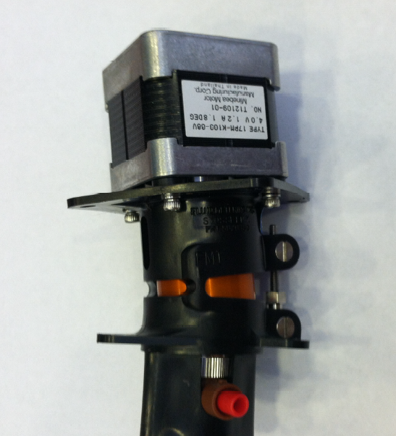 A close-up view of a small electric motor showcasing its intricate components and design details.