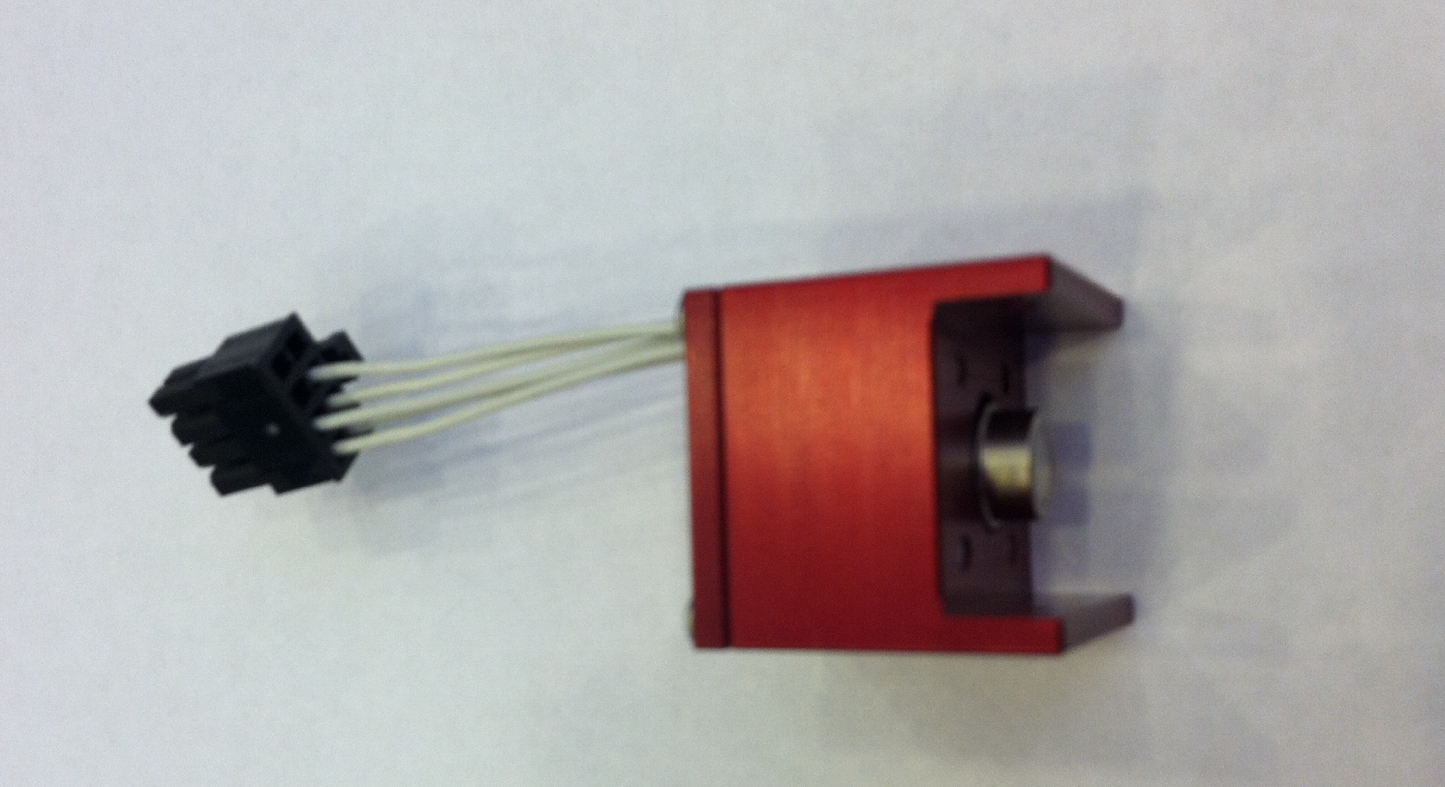 A compact red and black electrical device featuring several attached wires, highlighting its technical components.