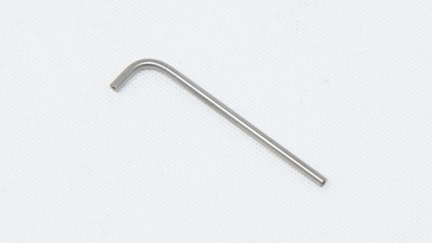 A close-up of "L" shaped stainless steel tube resting on a clean white surface, showcasing its shiny finish and intricate design.