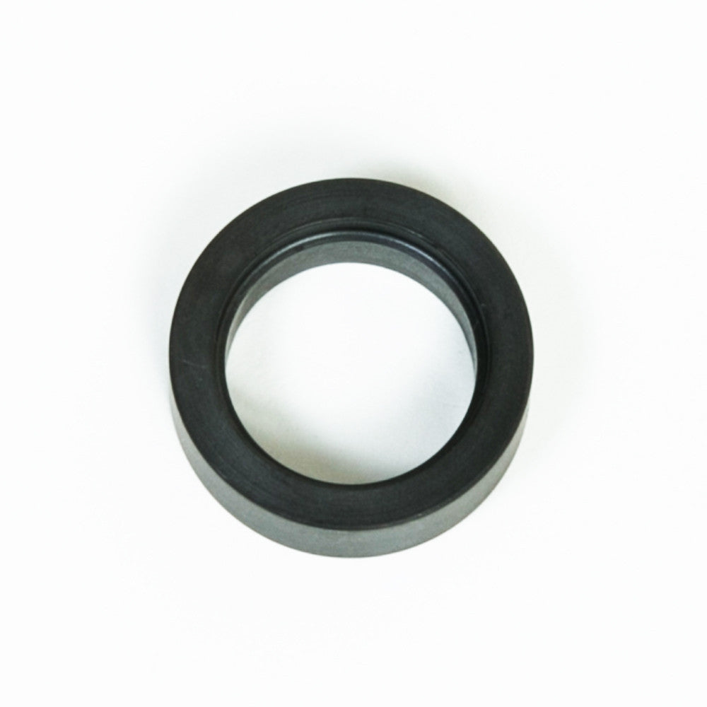 A black ring placed on a clean white background, showcasing its circular shape and smooth texture.