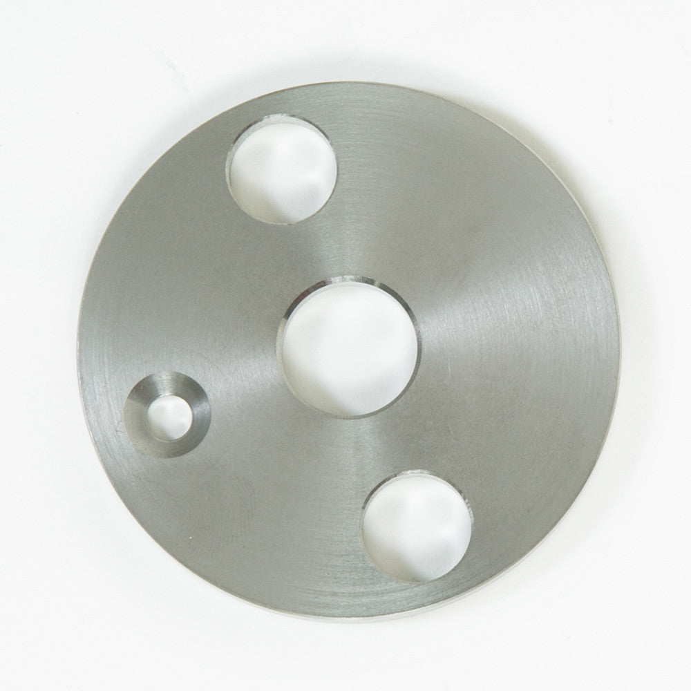 stainless steel disc featuring multiple evenly spaced holes throughout its surface.