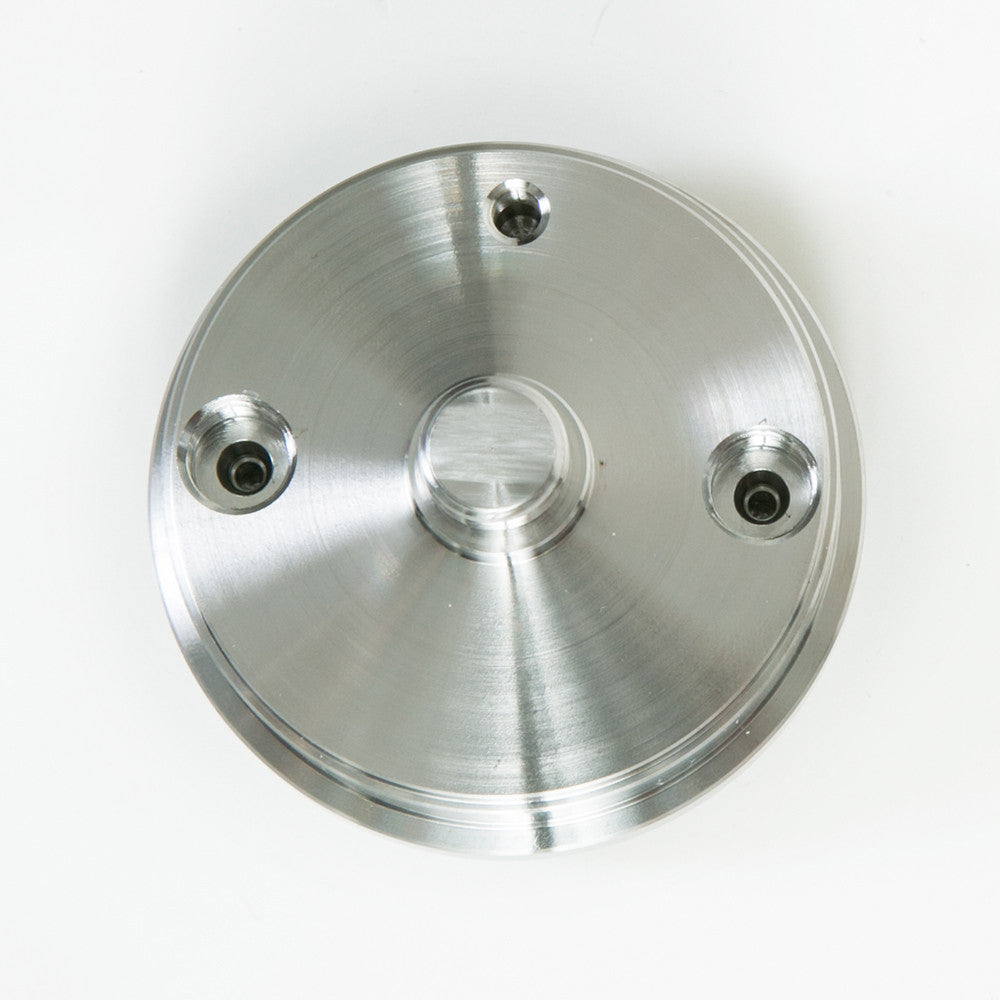 A single stainless steel piston displayed on a white background, emphasizing its shiny texture and precise threading design.