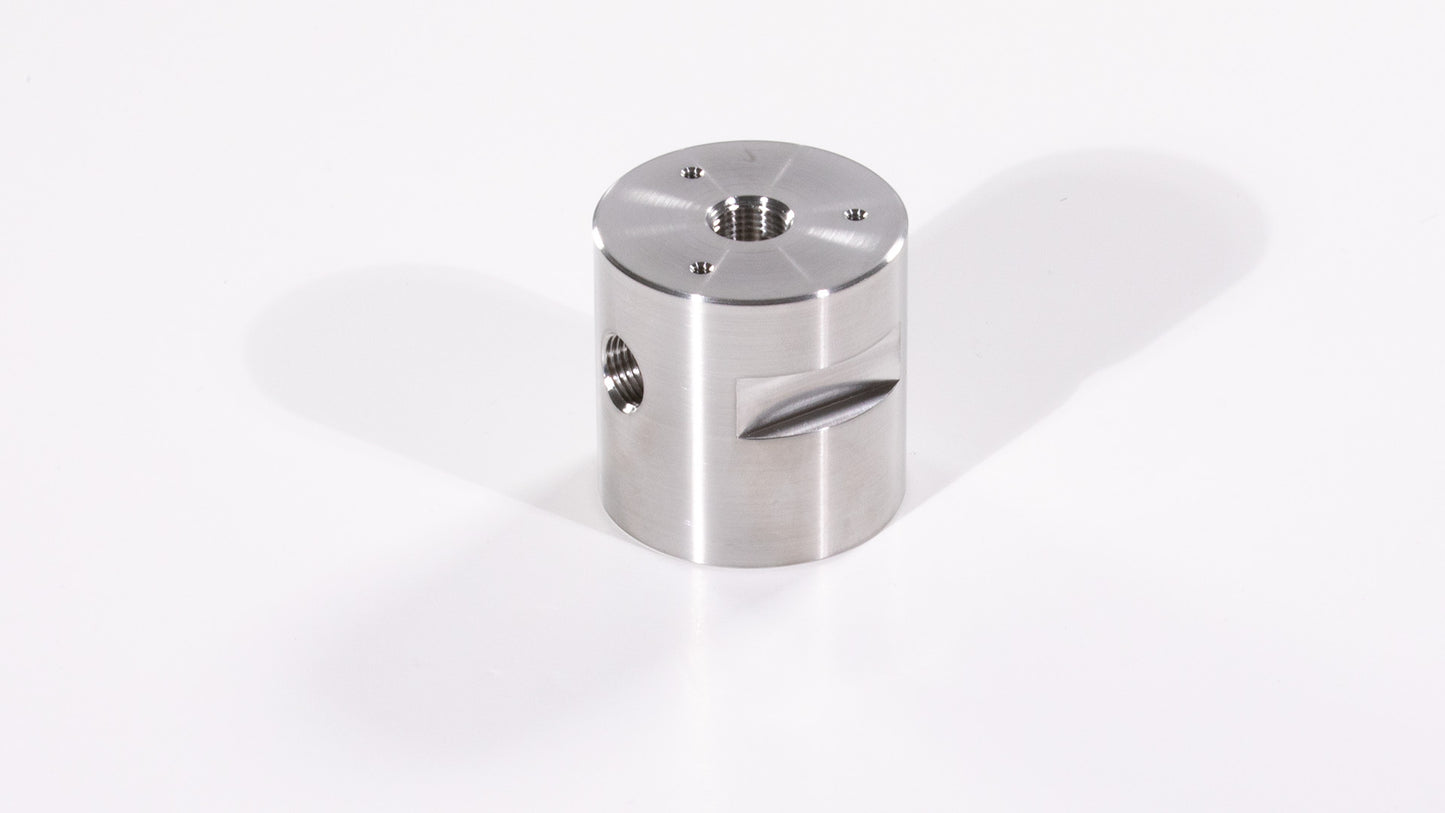A stainless steel cylinder featuring a central hole, showcasing its sleek and modern design.