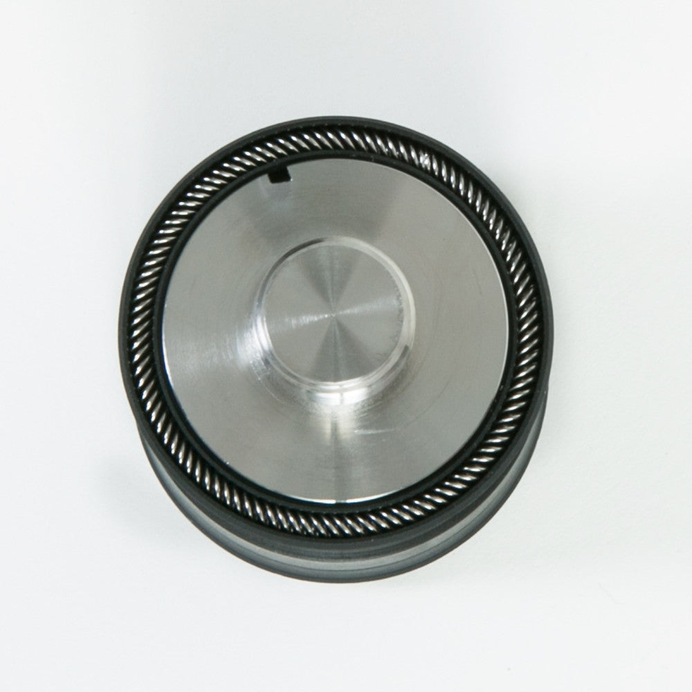 A sleek black and silver metal cylinder with two circular holes, designed for functional use.