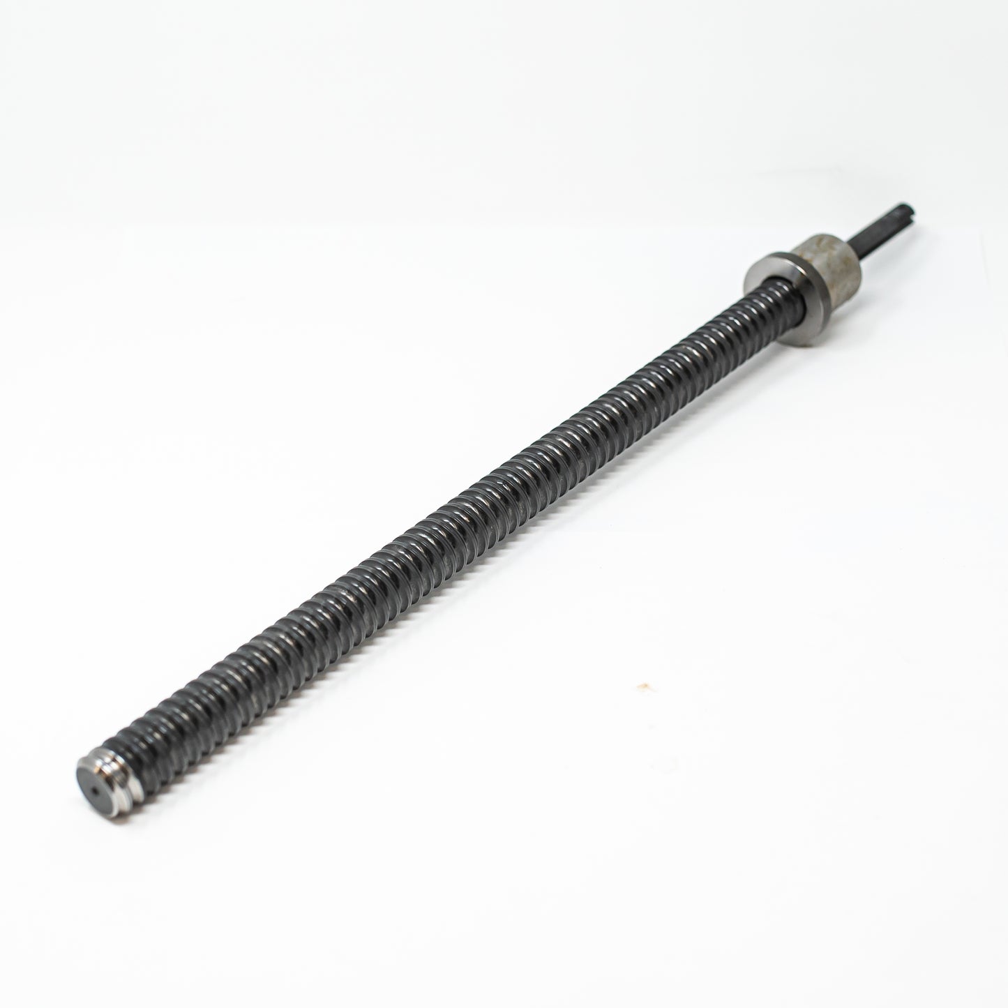 A long-shafted screw accompanied by a nut, showcasing their connection and functionality in mechanical applications.