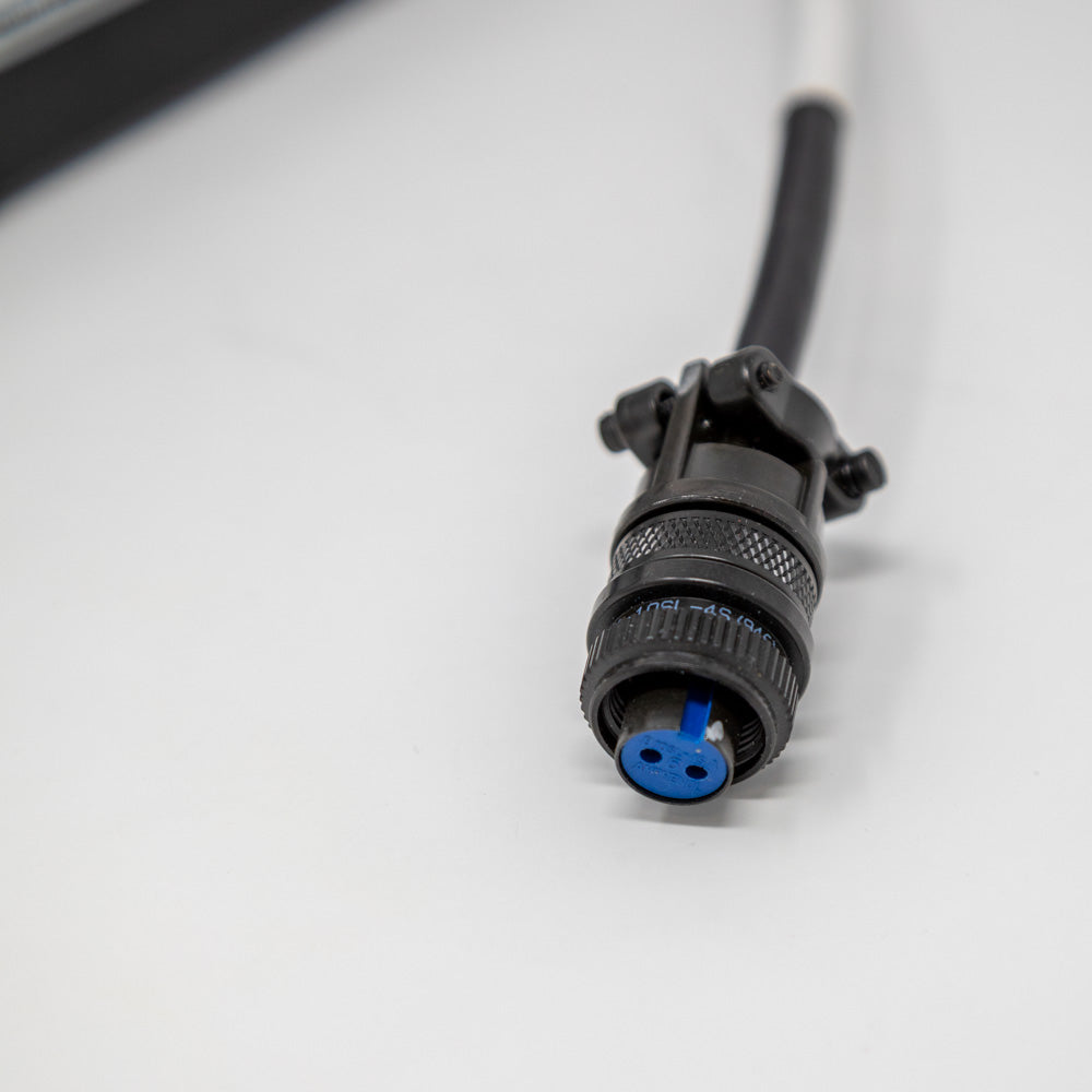 A black two pin connector, showcasing a simple and functional design for power supply.