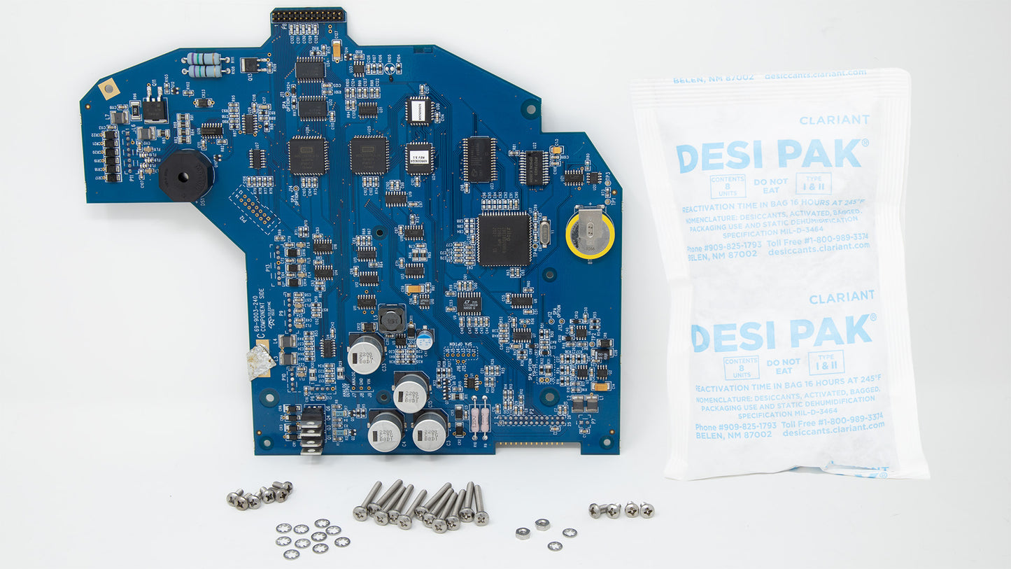 A circuit board assembly kit displayed, featuring various components and tools for electronic assembly projects.