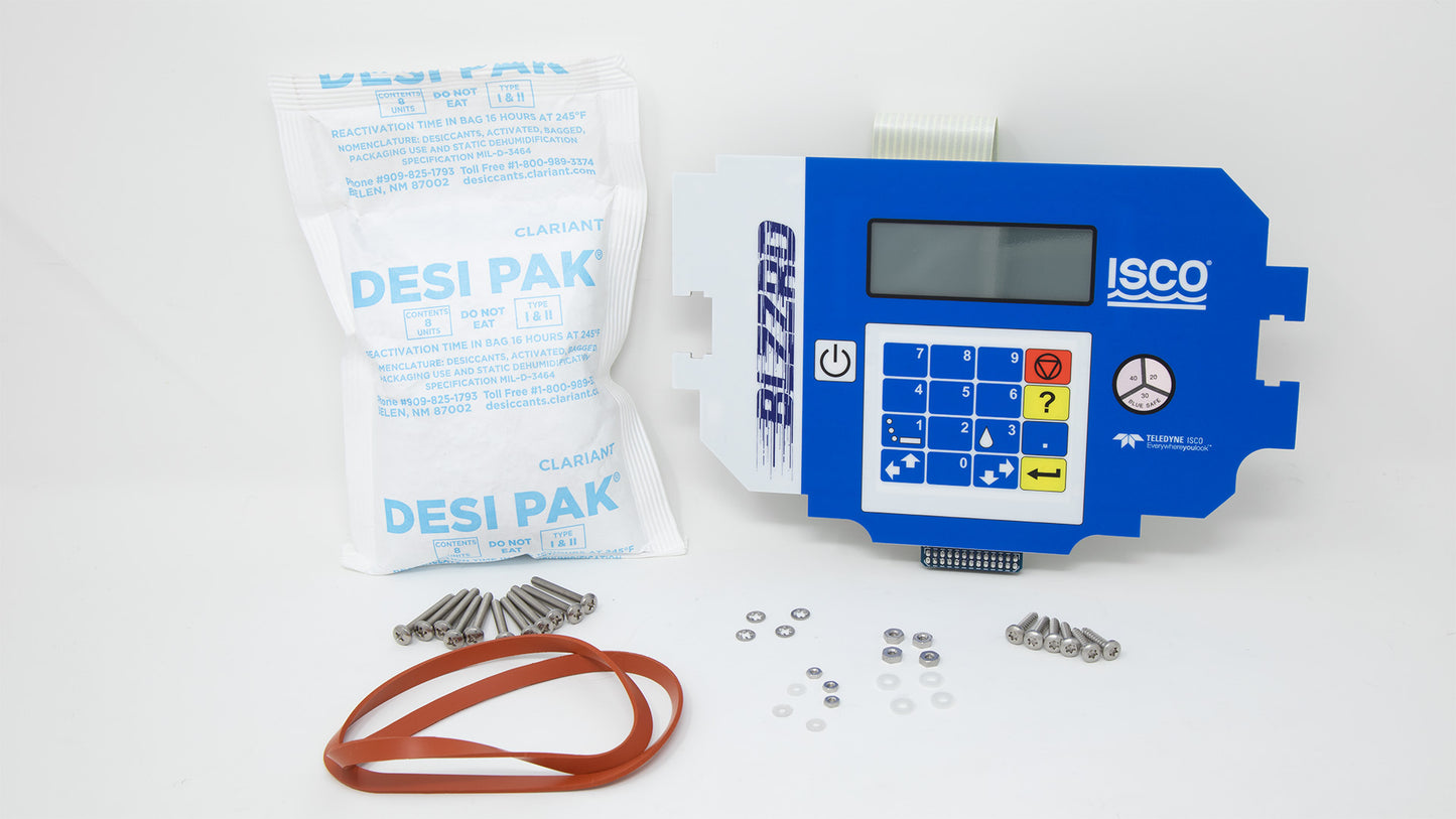 A blue and white keypad displayed alongside a bag and various mounting hardware, indicating preparation for installation or maintenance tasks.