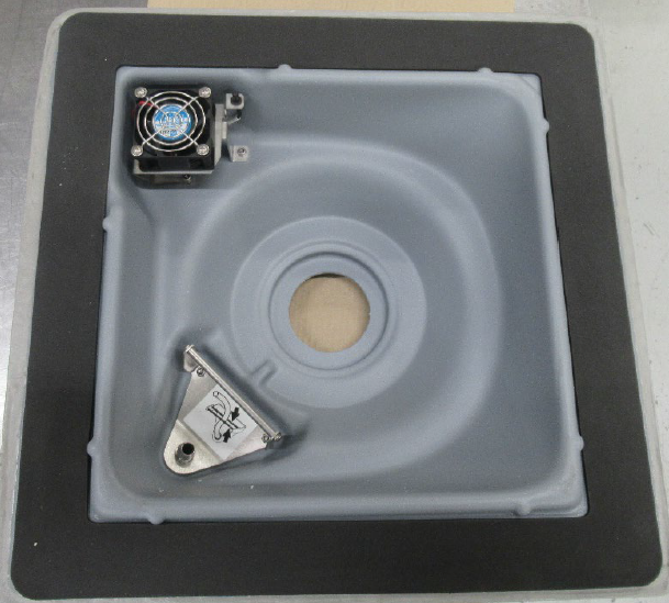A molded plastic plate with a central opening and screws positioned around the edge for secure attachment.