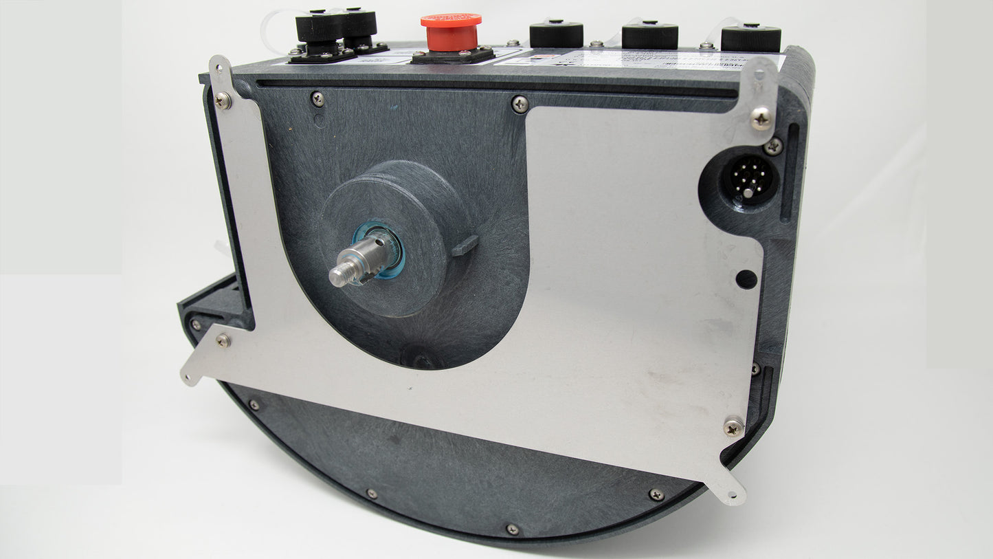 Detailed view of a metal machine showcasing a striking red button, emphasizing its mechanical features and operational purpose.