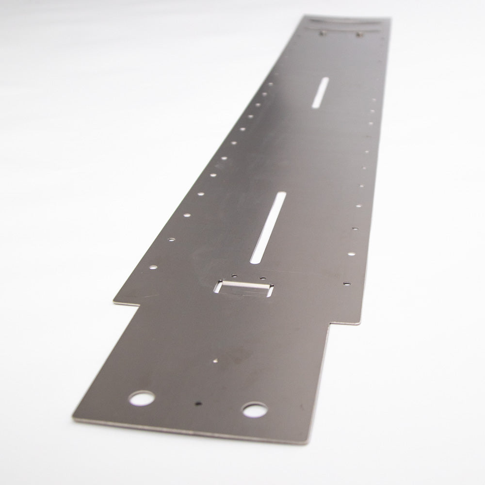 A metal plate characterized by various holes, including a specific hole intended for a screw.