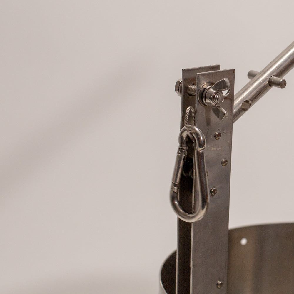 A metal handle and a prominent ring for secure lifting.