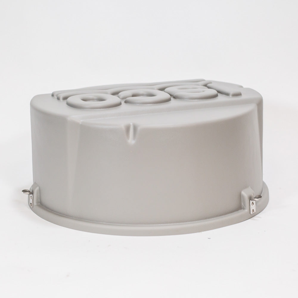 A gray round plastic cover displaying the word ISCO prominently on its surface.