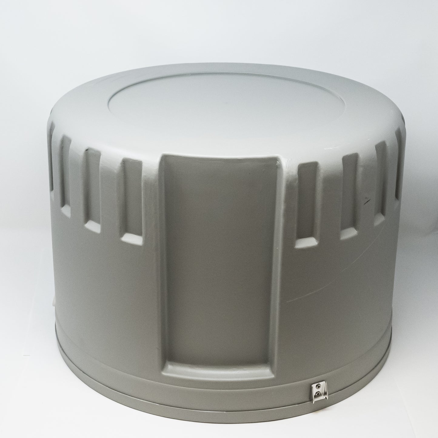 A gray plastic container, suitable for storage and organization purposes.