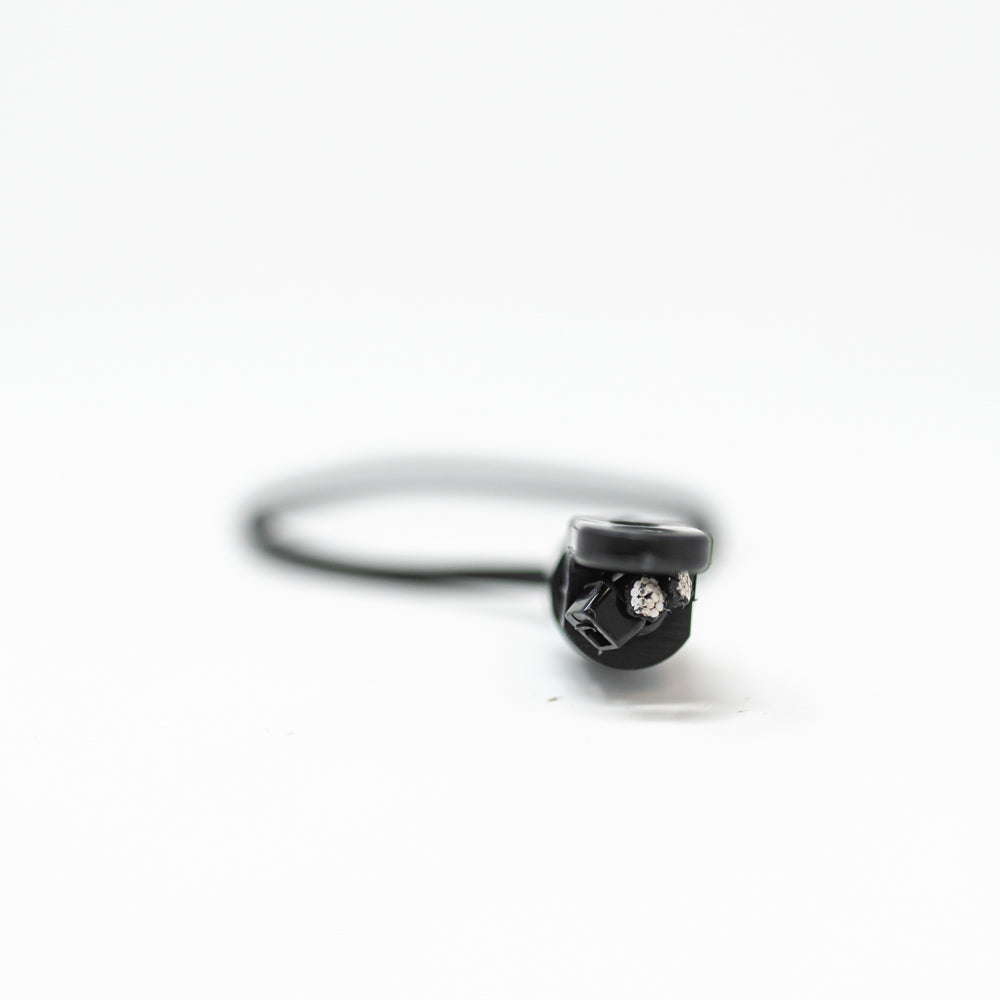 A black cord featuring a small metal clip attached to it, suitable for various fastening purposes.