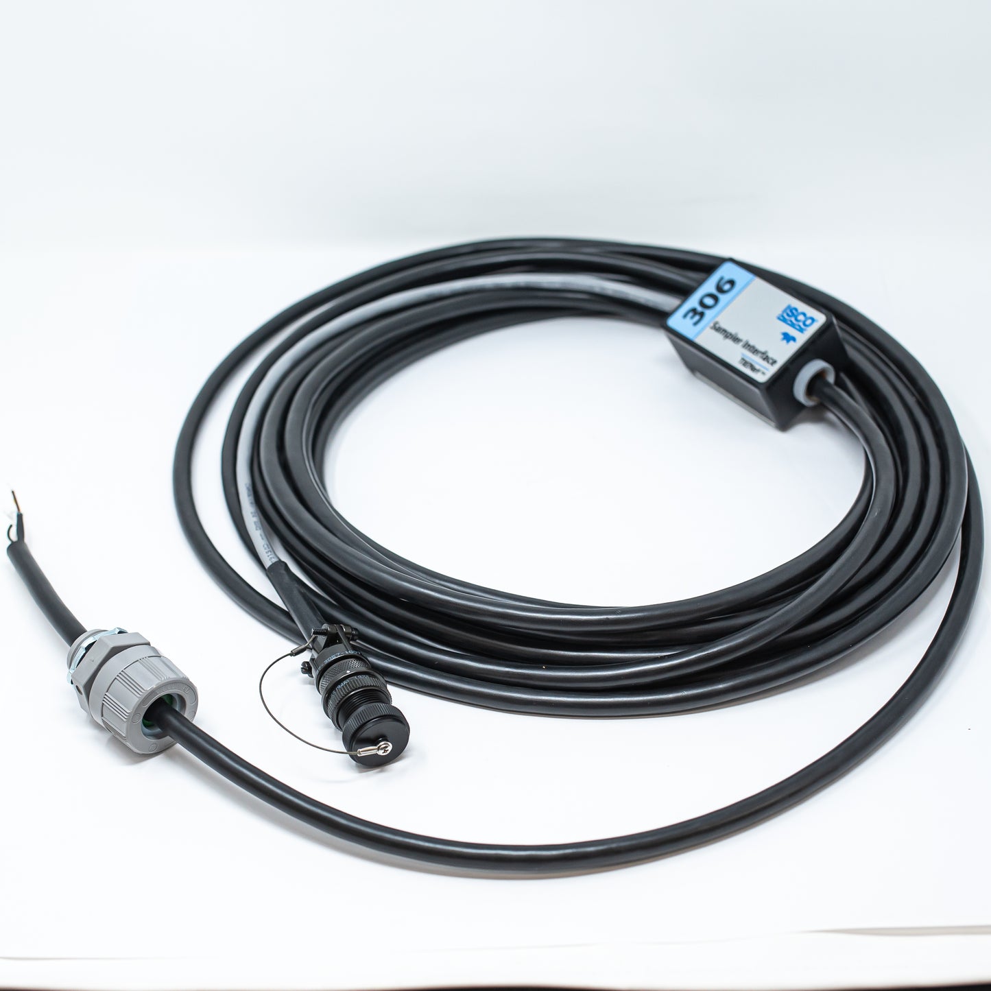 A cable connected to a small black box, illustrating a simple electronic setup or device.