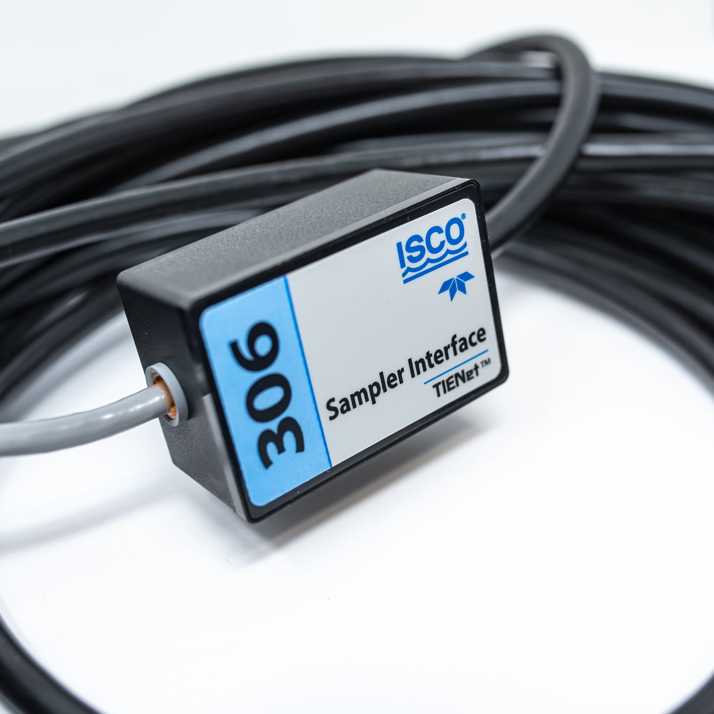 A cable connected to a small black box, illustrating a simple electronic setup or device.